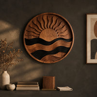 Detail of circular carved sun and wave wall art with dark and natural wood bands beside wood, brass and linen samples