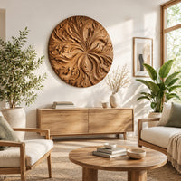 Round wood wall art with swirling carved petals in relief in a bright sunroom with green plants