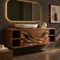 Corner detail of floating bathroom vanity with wave carved doors and end shelves beside wood, brass and linen samples