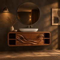 Floating bathroom vanity with wave carved doors and end shelves in a dark bathroom at golden hour