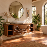 Floating bathroom vanity with wave carved doors and end shelves in a bright bathroom with arched windows and plants