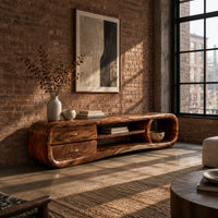 Capsule tv stand with drawers and a round open cubby in an industrial loft living room with exposed brick