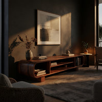 Rounded TV console with three open bays in a living room at golden hour