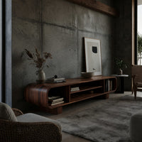 Rounded TV console with three open bays in a concrete and timber loft