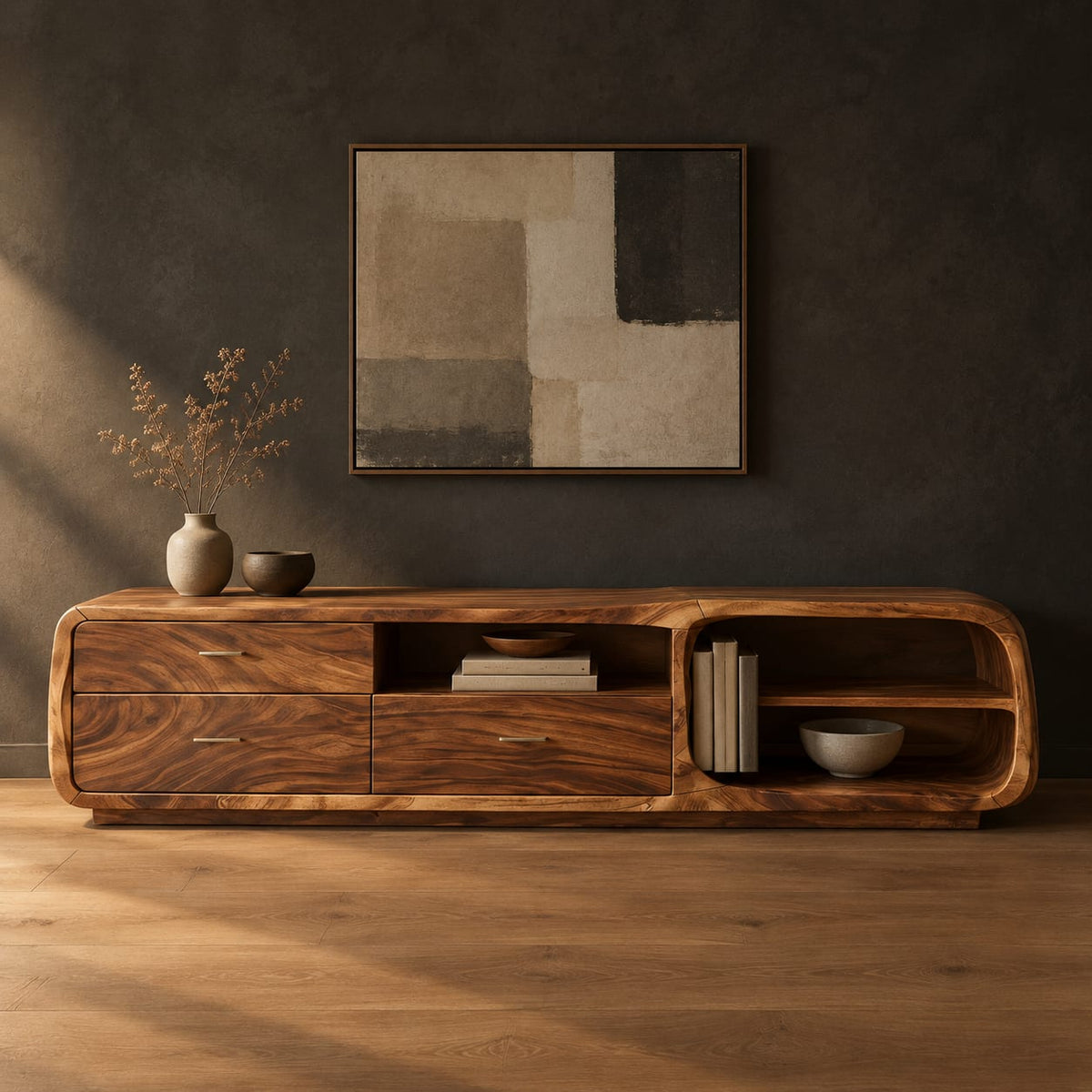 Low rounded tv stand with three drawers and open shelves in a dark studio against a charcoal plaster wall