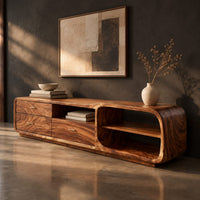 Low rounded tv stand with three drawers and open shelves, three-quarter view showing the grain