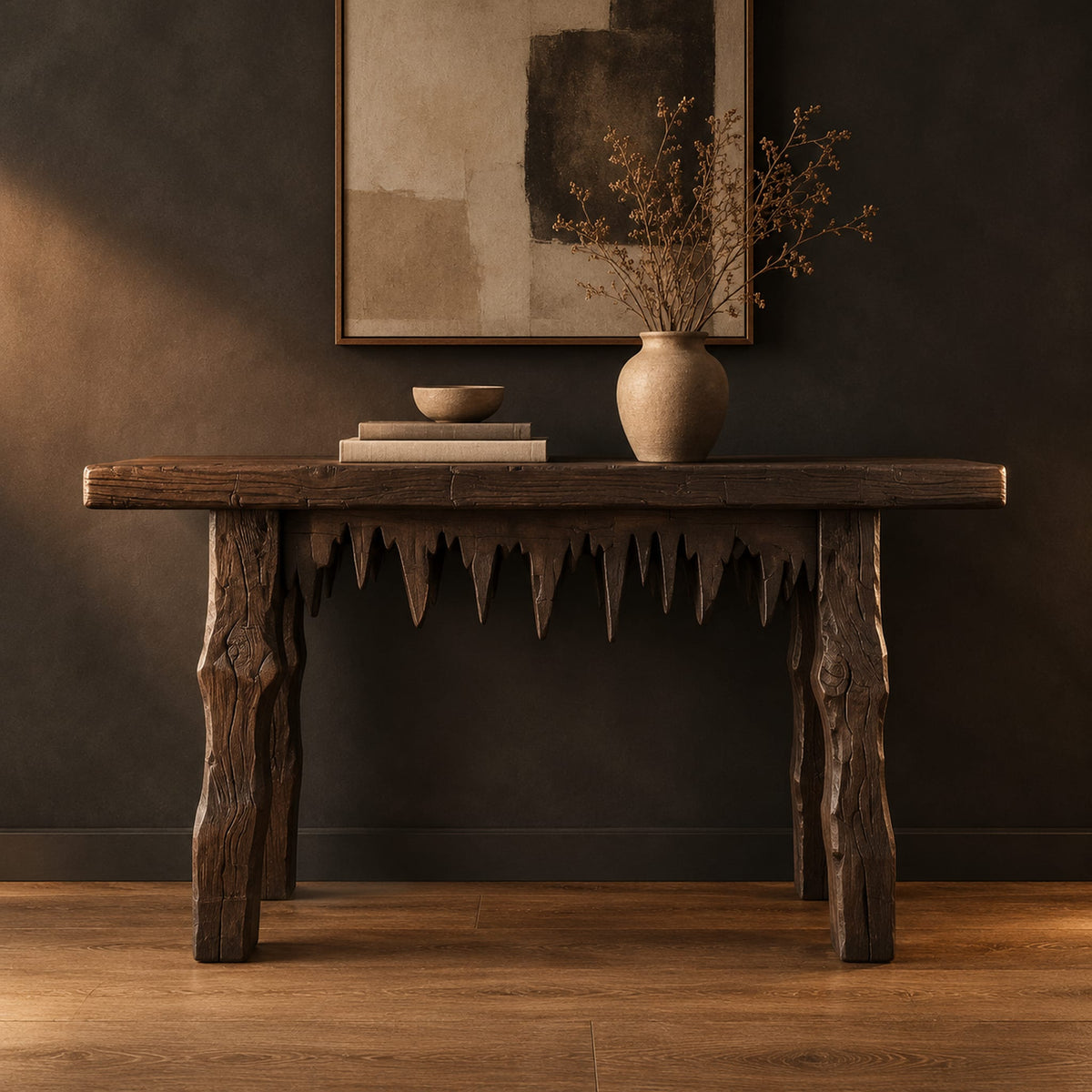 Rustic plank console table with thick legs and a jagged drip edge apron in a dark studio against a charcoal plaster wall