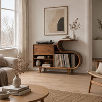 Low record cabinet with an s shaped open bay and slim tapered legs in a Scandinavian living room with white walls