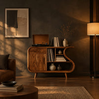 Record player stand with an s shaped side, one door and open shelves in a dark living room at golden hour