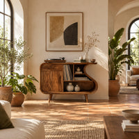Record player stand with an s shaped side, one door and open shelves in a bright living room with arched windows and plants