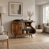 Record player stand with an s shaped side, one door and open shelves in a Scandinavian living room with white walls