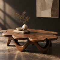 Petal edged coffee table on a rolling arched base, three-quarter view showing the grain