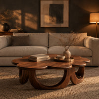 Scalloped coffee table on a ring of arched wooden panels in a dark living room at golden hour