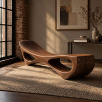 Scooped seat bench with two open oval cutouts in its body in an industrial loft entryway with exposed brick