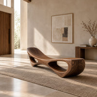 Scooped seat bench with two open oval cutouts in its body in a bright open plan entryway