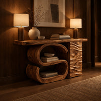 Console table with a large scroll base and a wave carved side column in an evening entryway with walnut wall paneling