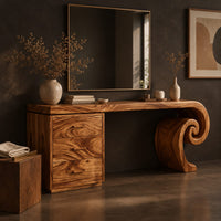 Corner detail of makeup vanity desk with a spiral scroll leg and a three drawer cabinet beside wood, brass and linen samples