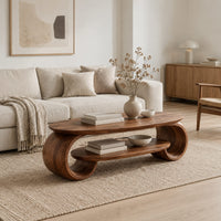 Oval coffee table with scrolled end supports and a lower oval shelf in a Scandinavian living room with white walls