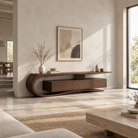 Tv stand with a sweeping scroll end and a three panel cabinet in a bright open plan living room