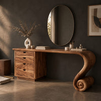 Corner detail of makeup vanity with four drawers and a sweeping top ending in a scroll leg beside wood, brass and linen samples