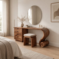 Makeup vanity with four drawers and a sweeping top ending in a scroll leg in a Scandinavian bedroom with white walls