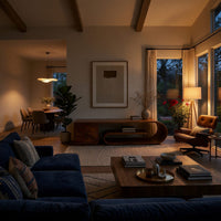 Scroll shelf TV stand with a cantilevered top in an evening room lit by two lamps