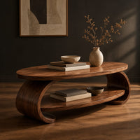 Oval coffee table with scrolled sides and a low shelf, three-quarter view showing the grain