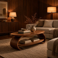 Oval coffee table with scrolled sides and a low shelf in an evening living room with walnut wall paneling