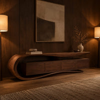 Low tv stand with a scroll end top, four front panels and wavy base in an evening living room with walnut wall paneling