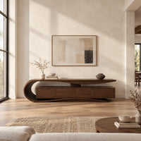 Low tv stand with a scroll end top, four front panels and wavy base in a bright open plan living room