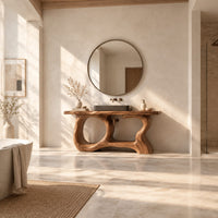 Open frame vanity with a freeform slab top and a sculpted looping base in a bright open plan bathroom