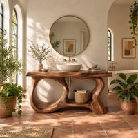 Freestanding vanity base with looping open legs and a thick wood slab top in a bright bathroom with arched windows and plants