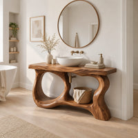 Freestanding vanity base with looping open legs and a thick wood slab top in a Scandinavian bathroom with white walls