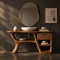 Corner detail of freeform vanity cabinet with a swooping leg and a small drawer above open cubbies beside wood, brass and linen samples