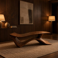 Long low bench with a wave shaped plank seat on a swept base in an evening entryway with walnut wall paneling