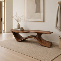 Long low bench with a wave shaped plank seat on a swept base in a Scandinavian entryway with white walls