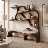 Sculpted bookshelf with an integrated bench seat and open shelves in a Scandinavian living room with white walls
