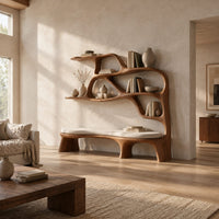 Sculpted bookshelf with an integrated bench seat and open shelves in a bright open plan living room