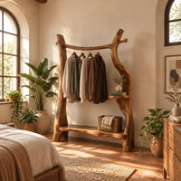 Open branch frame wardrobe with a hanging rail and two shelves in a bright bedroom with arched windows and plants