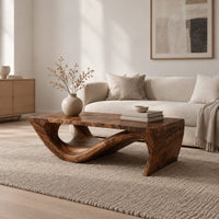 Rectangular coffee table with a thick top over a swooping open loop base in a Scandinavian living room with white walls