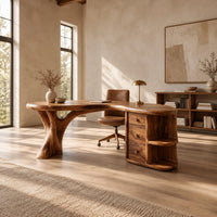 Kidney shaped wood desk with a tree trunk leg and a drawer pedestal in a bright open plan home office