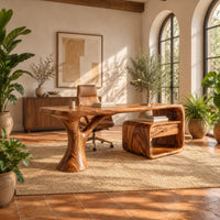 Sculpted desk with a tree trunk leg and a loop frame side unit in a bright home office with arched windows and plants