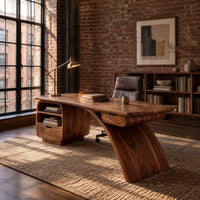 Desk with a swooping blade leg and a cubby and drawer pod in an industrial loft home office with exposed brick