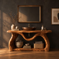 Bathroom vanity with sculpted wavy legs and an open lower shelf in a dark studio against a charcoal plaster wall