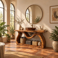 Bathroom vanity with sculpted wavy legs and an open lower shelf in a bright bathroom with arched windows and plants
