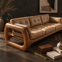 Corner detail of three seat sofa with tufted cushions and open loop wooden arms beside wood, brass and linen samples
