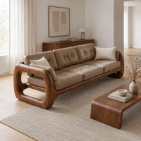 Three seat sofa with tufted cushions and open loop wooden arms in a Scandinavian living room with white walls