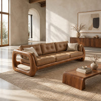Three seat sofa with tufted cushions and open loop wooden arms in a bright open plan living room