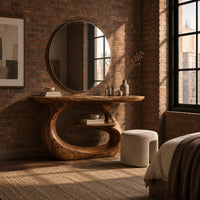 Oval top makeup vanity on a looping pedestal base with a small inner shelf in an industrial loft bedroom with exposed brick