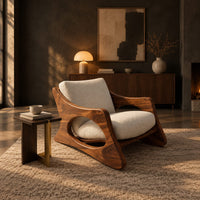 Sculptural lounge chair with oval side cutouts and a cushioned seat in a dark living room at golden hour